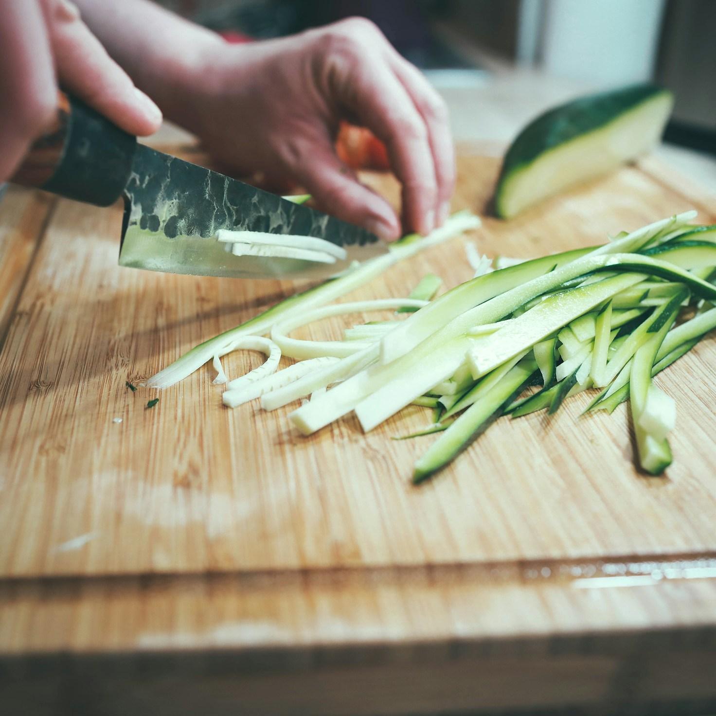 Community members collaborating in a modern kitchen space, sharing recipes and cooking techniques